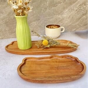 Acacia Wood Trays Wholesale: Cloud shaped serving trays for home decor, with vase and coffee cup.