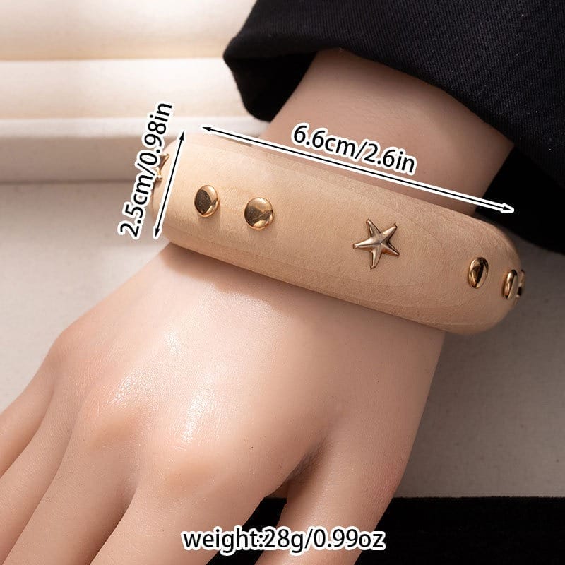 Black Wooden Bangle Cuff: Wide studded wooden bracelet with gold accents.