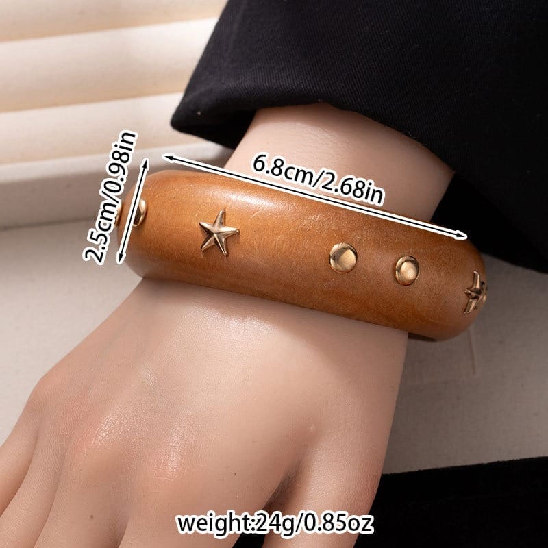 Black Wooden Bangle Cuff: Wide brown studded wooden bracelet with star and dot accents.