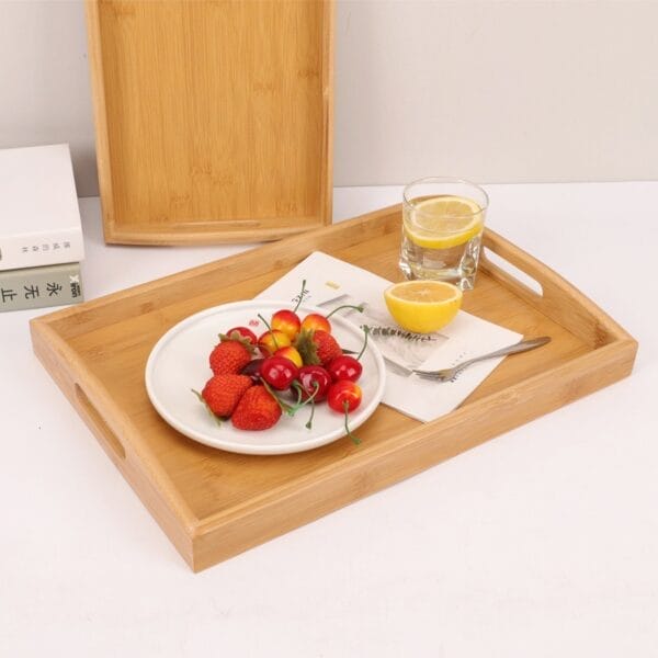 Large Personalised Wooden Butler Tray: Bamboo serving tray with fruit, lemon water, and double handles.