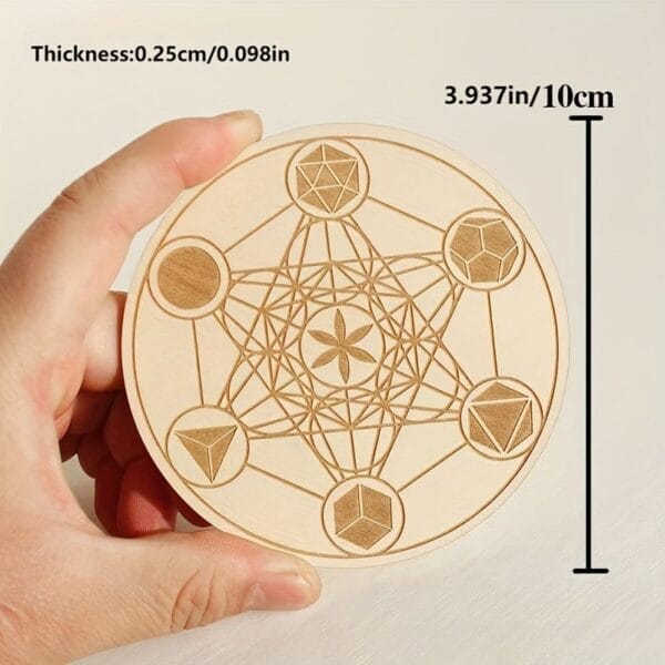 Engraved wooden coaster featuring Metatron's Cube design. Laser-cut geometric pattern, 10cm diameter.