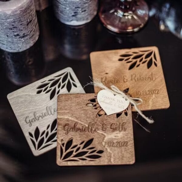 Personalized Wooden Coasters: Laser-cut floral wedding favors with custom names & dates. Unique guest gifts.