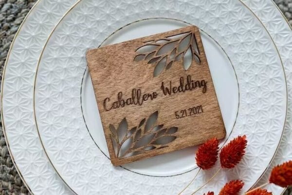 Personalized Wooden Coaster Wedding Favor with "Caballero Wedding" and date, floral laser-cut design.
