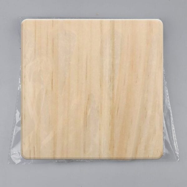 AUTO-DRAFT: Square unfinished wooden board, ready for crafting, sealed in plastic wrap.