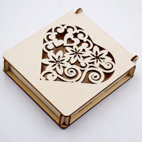 Custom Carved Wooden Box: Laser-cut heart design on a carved wooden box.