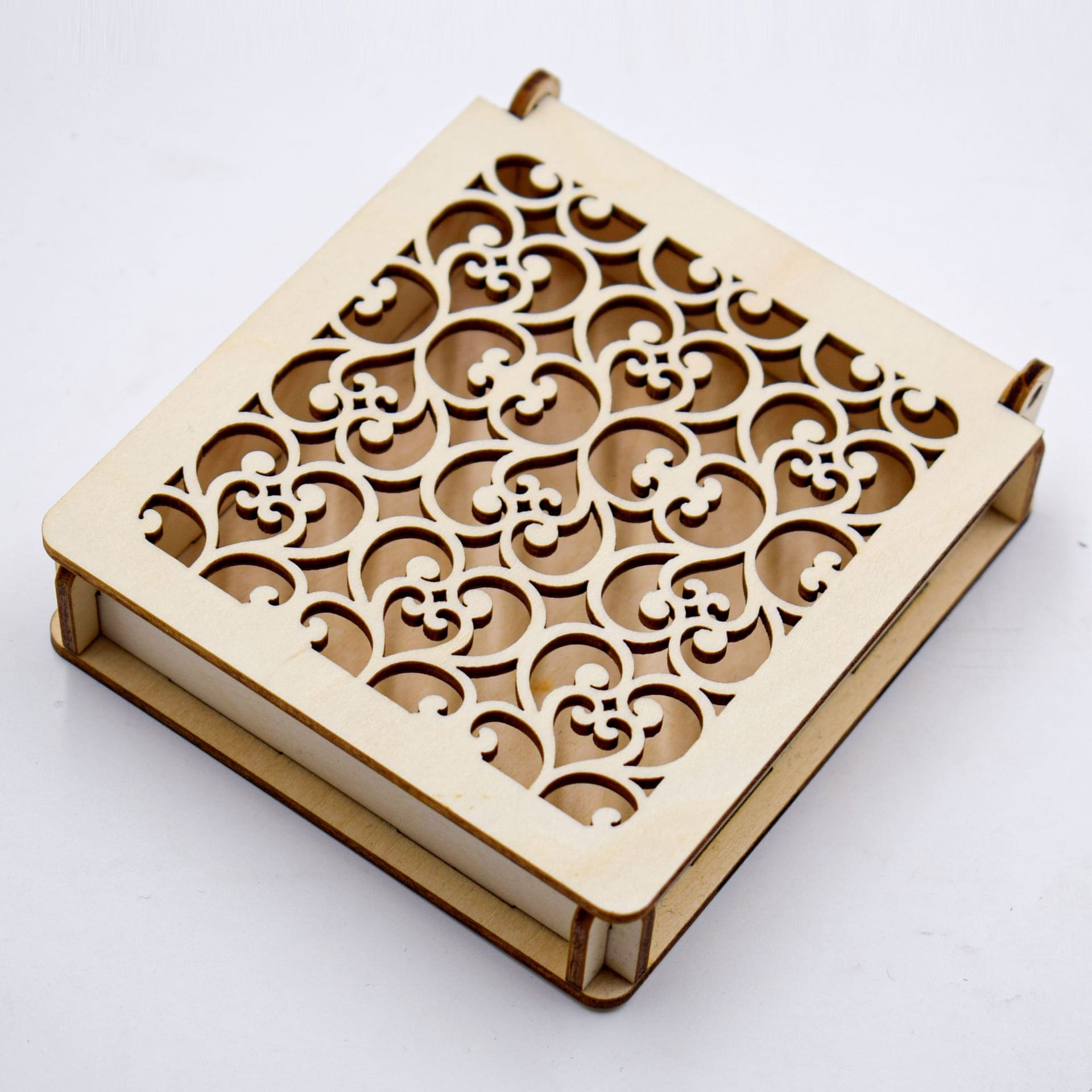 Custom Carved Wooden Box: Laser-cut decorative box with intricate scrollwork design.