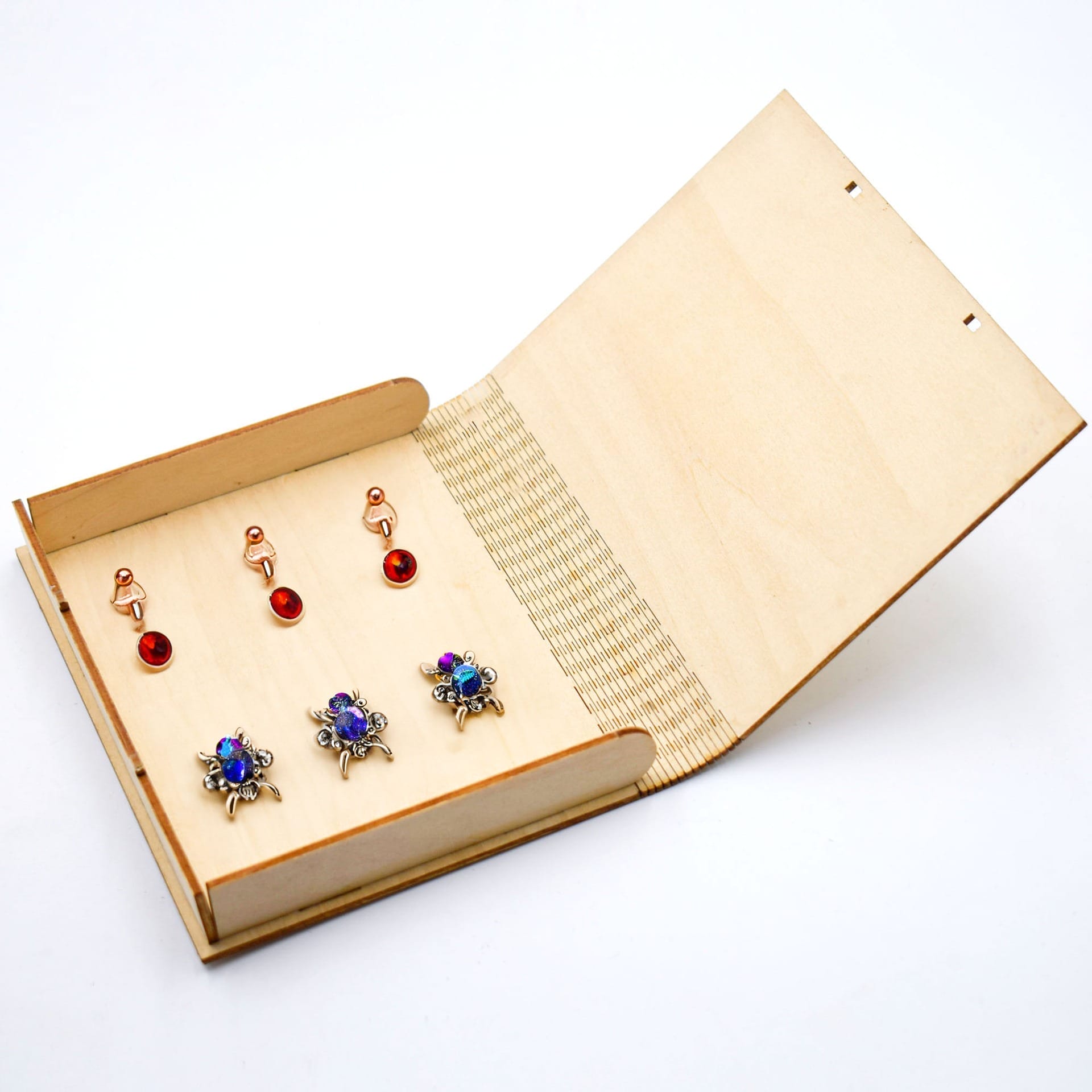 Custom Carved Wooden Box Laser Cut Box Wholesale Manufacturer holding earrings. A beautiful carved wooden box.
