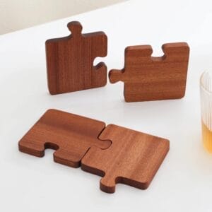 Wooden puzzle piece coasters, interlocking design, perfect for home decor and protecting surfaces.