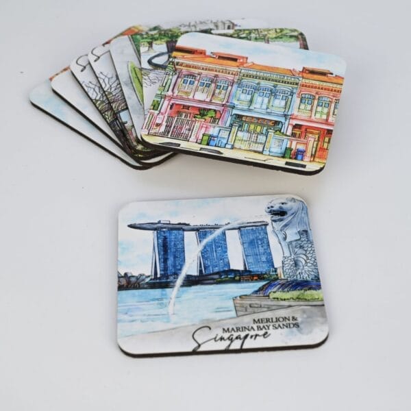 Singapore coasters featuring local landmarks: Colorful buildings & Merlion statue with Marina Bay Sands.