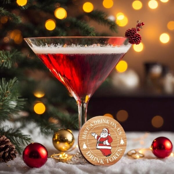 Custom Wooden Drink Token featuring Santa next to a festive cocktail. Boxwood party tokens for weddings, bars & promotions.