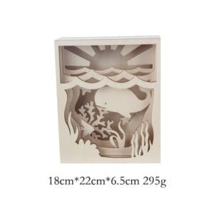 Laser Cut Wood Shadow Box: Wooden layered diorama of ocean scene with whale, fish, coral, and sun.