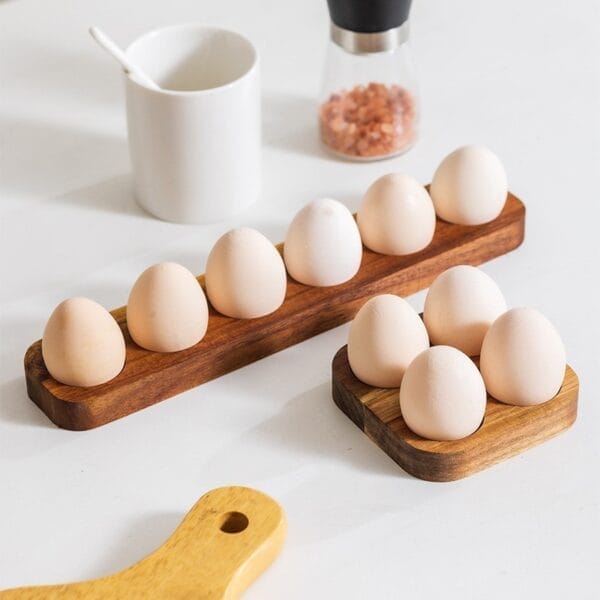 Eggs displayed on a wooden egg holder, rustic kitchen decor