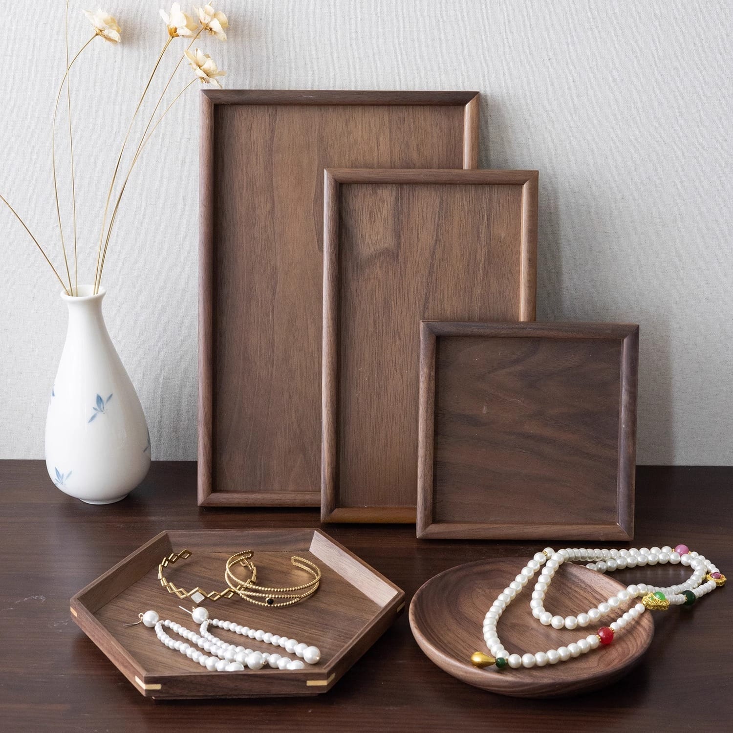Walnut Personalised Wooden Jewellery Trays for boutique display and storage: assortment of wood trays with jewelry.