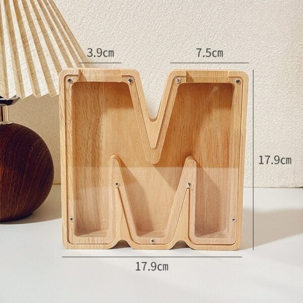 Letter M wooden coin bank with clear front, dimensions 17.9cm x 17.9cm, a unique kids money saving box