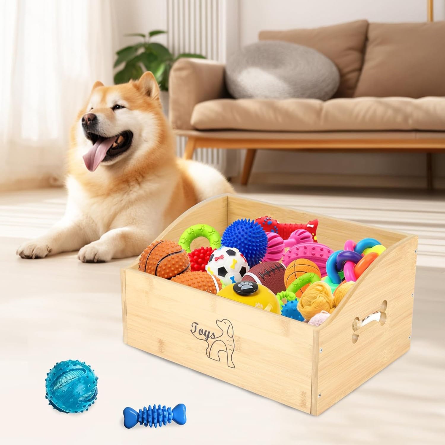 Wooden dog toy storage box filled with colorful toys, with a happy dog nearby.