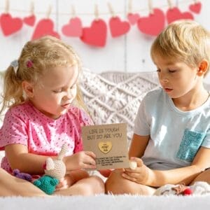 Pocket Hug card with kids. Personalized wooden token with engraved mini coin for support & comfort.