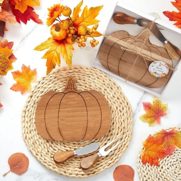 Pumpkin-shaped wooden cheese board with cheese knives set, perfect for fall entertaining.