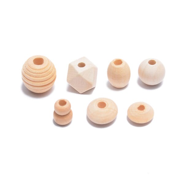 Assorted unfinished wood beads in various shapes: round, cube, barrel, and stacked, perfect for DIY jewelry projects.