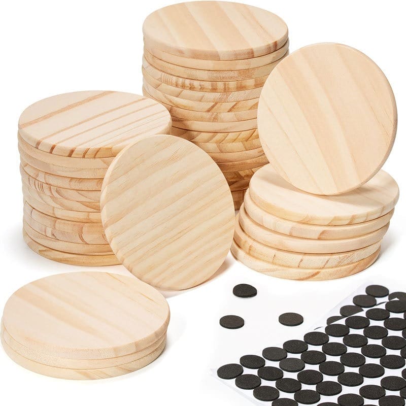 Unfinished wooden circles stacked with black felt pads for crafts, DIY projects, and home decor