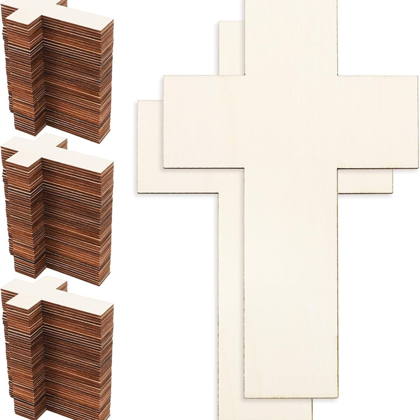 Stacks of unfinished wooden crosses, some stacked and some laid out flat.