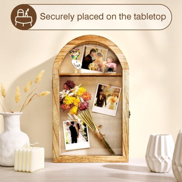 Arched wooden photo display shelf with wedding photos, dried flowers, and decorative objects.