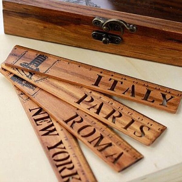 AUTO-DRAFT: Wooden folding ruler featuring Italy, Paris, Roma, New York. Vintage-style measuring tool.