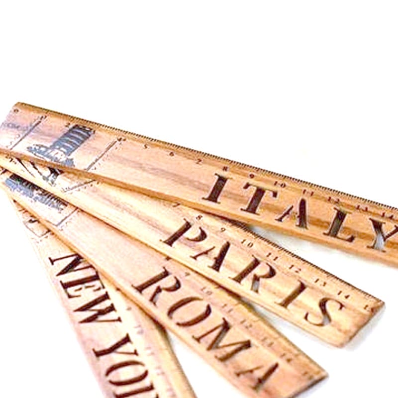 AUTO-DRAFT: Wooden rulers featuring Italy, Paris, Roma, and New York city names