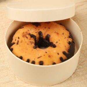 Donut in round container with lid