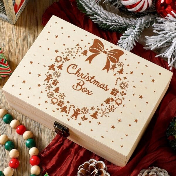 Wooden Christmas box with festive decorations, including a bow, snowflakes, and gingerbread men.