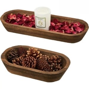 Two wooden dough bowls: one with rose petals & candle, the other filled with natural pine cones.