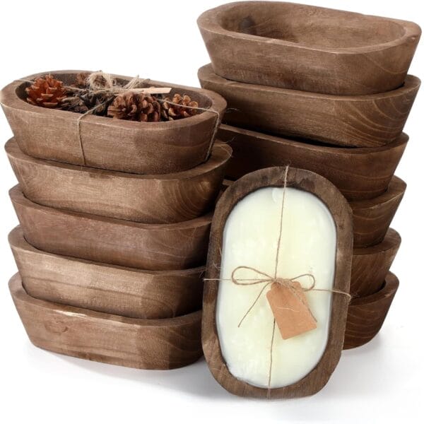 Stack of rustic wooden dough bowls, one with a candle, another with pinecones for farmhouse decor