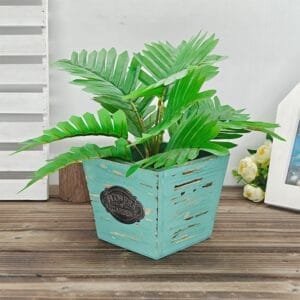 Wholesale Wooden Flower Boxes . Faux palm plant in rustic blue wooden pot with "Flowers & Garden" plaque.