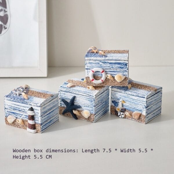 Nautical themed wooden boxes with beach decor: starfish, seashells, lighthouse, and life preserver.