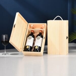 Two wine bottles in a wooden gift box, with a wine glass and separate box nearby. Wooden wine box wholesale