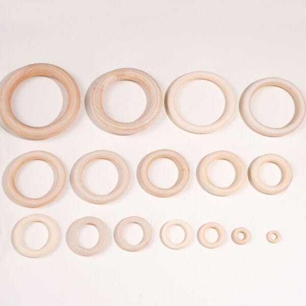 Assorted sizes of natural unfinished wooden craft rings for DIY projects