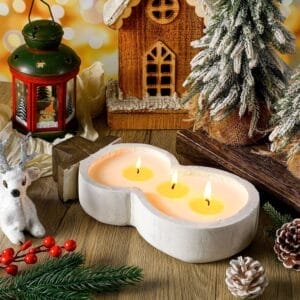 Wooden Dough Bowls Wholesale: Snowman-shaped candle holder with three lit candles, surrounded by Christmas decor.