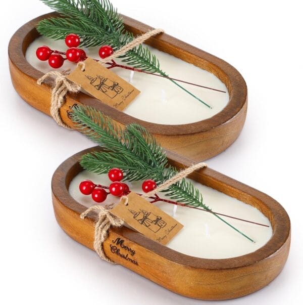 Christmas-themed wooden dough bowls for candle making. Oval bowls with candles, greenery, and "Merry Christmas" tag.