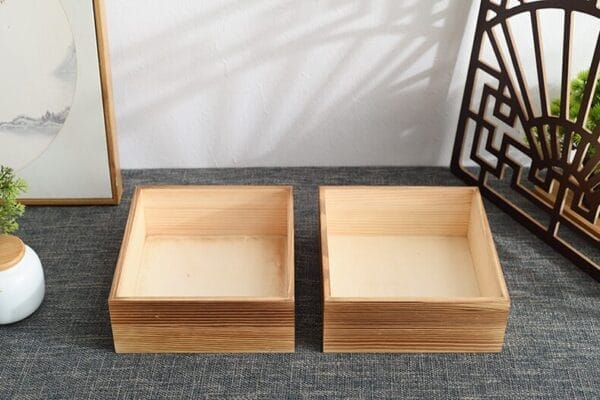 Two empty square wooden boxes, perfect for storage or display