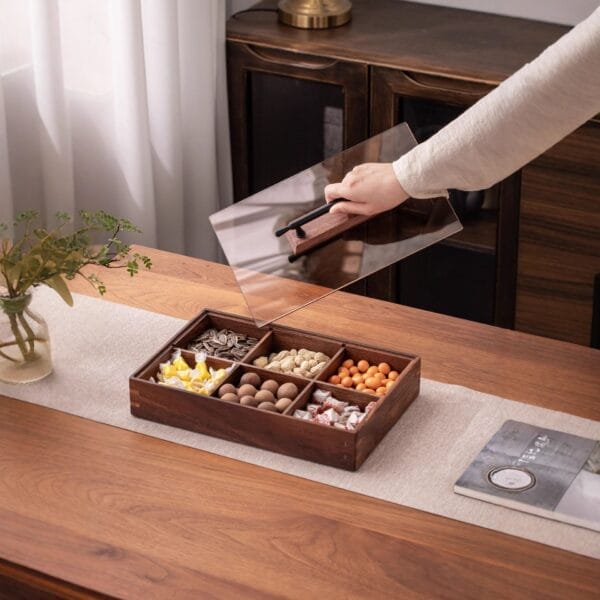 Premium Walnut Wooden Dry Fruit Box with 6 compartments filled with snacks, hand placing lid