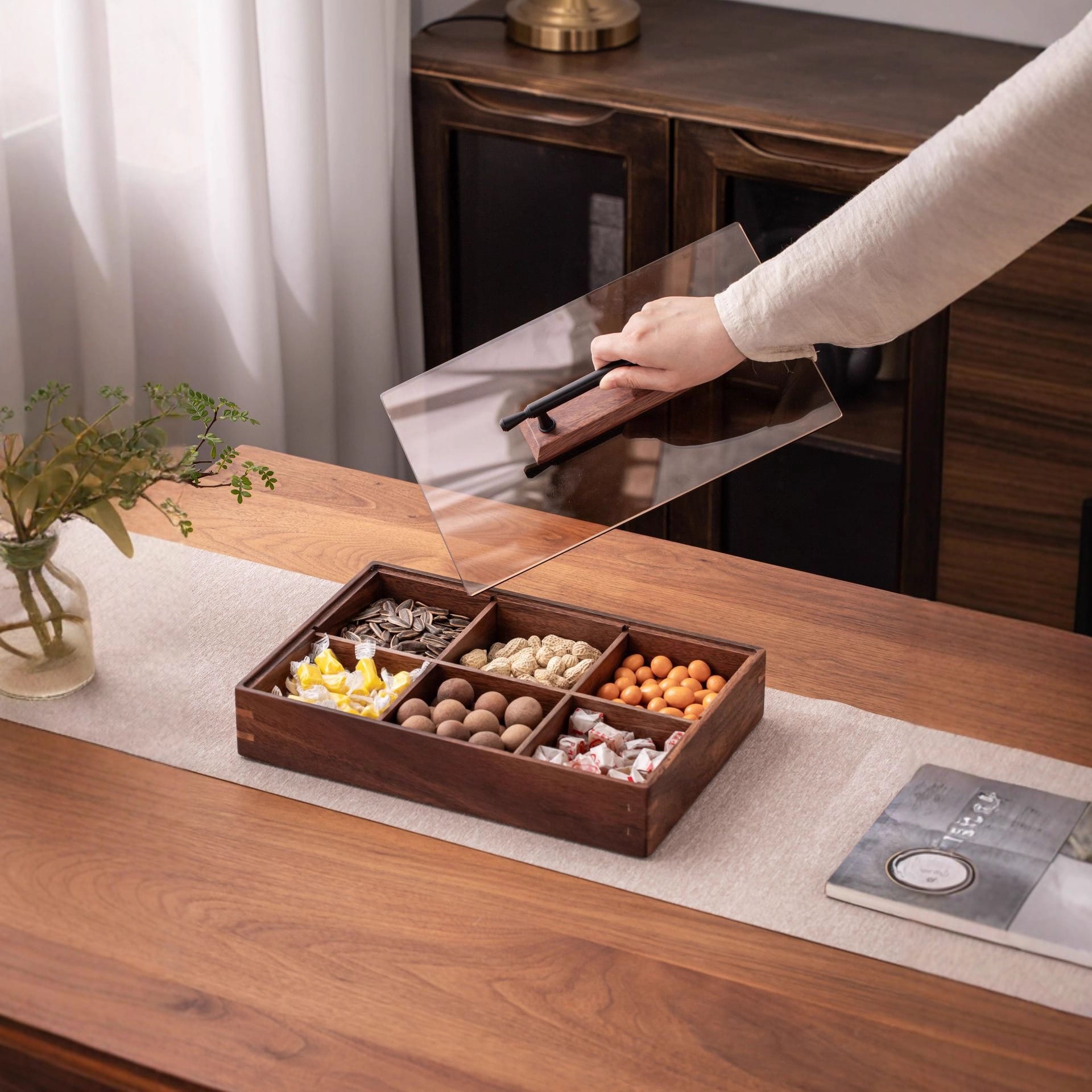 Premium Walnut Wooden Dry Fruit Box with 6 compartments filled with snacks, hand placing lid