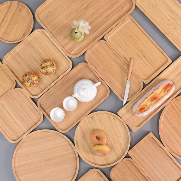 Custom Wooden Gift Tray Wholesale Manufacturer: Assorted wooden trays with bread, pastries, tea set, and flowers