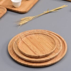 Custom Wooden Gift Tray Wholesale: Stacked round bamboo trays with wheat stalks, perfect for gifts.