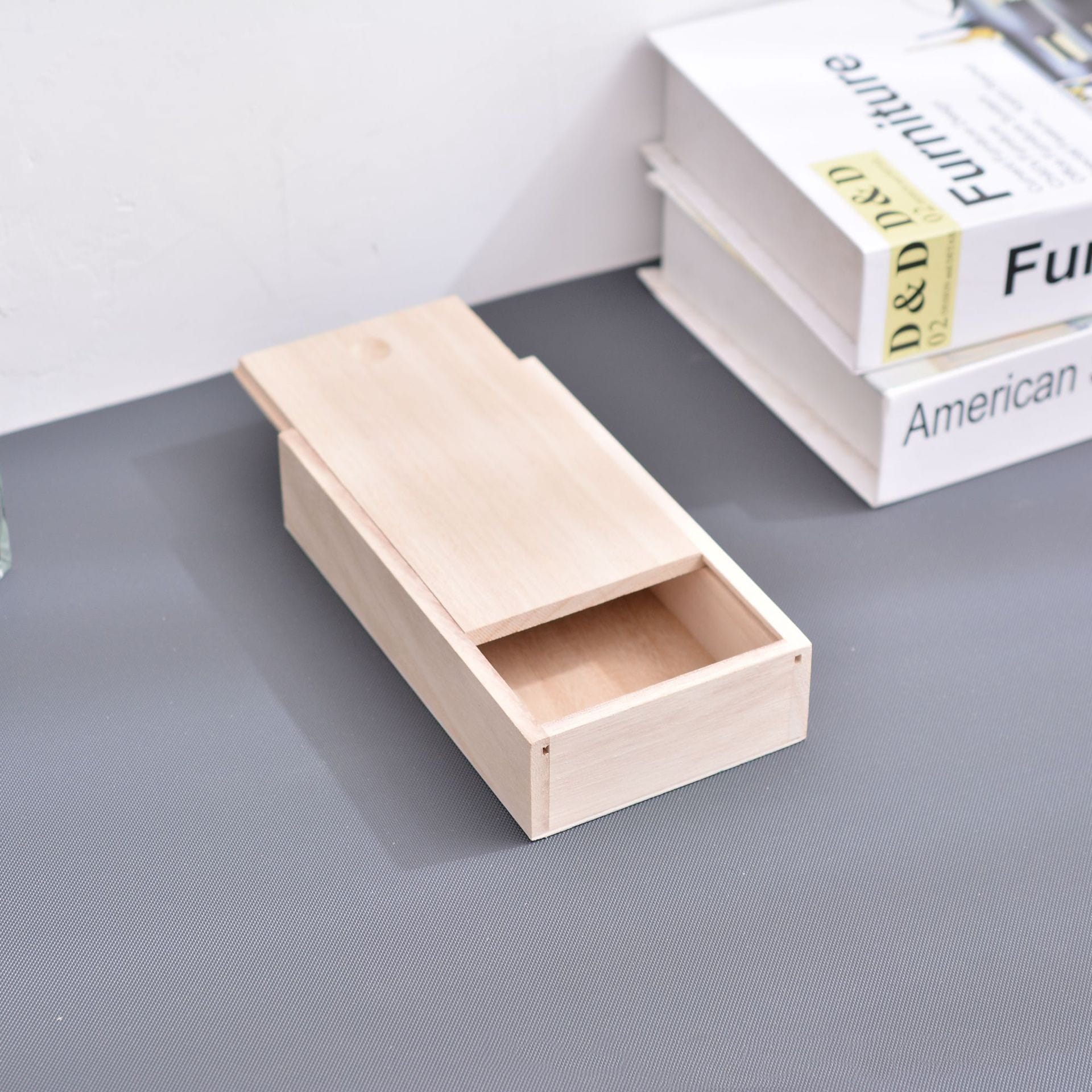 Wooden box with sliding lid, unfinished wood, perfect for crafts or storage.
