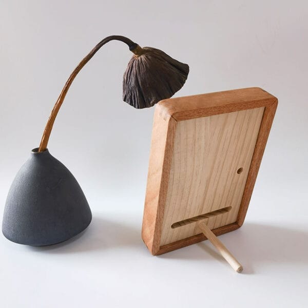 Wooden Picture Frame: Solid wood tabletop display frame shown with dried flower and vase.