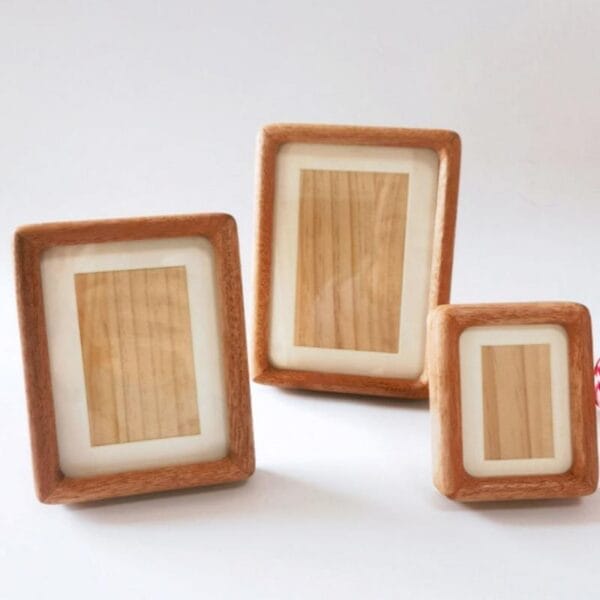 Wooden Picture Frames in Bulk: Solid wood tabletop display frames in three sizes, light brown finish.