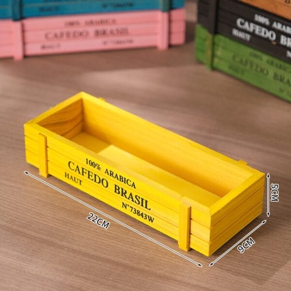 Yellow wooden crate planter box, labeled "100% Arabica Cafedo Brasil," with dimensions 22cm x 9cm x 5cm.