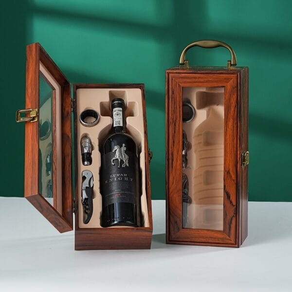 Wine bottle in an open wooden gift box with wine opener and accessories